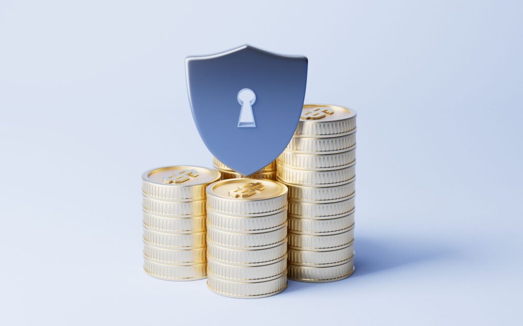 Shield lock icon on a stack of coins signifying to safeguard investments from inflation through below measures